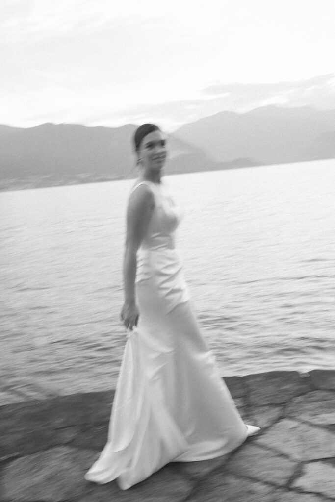 Bride walking along the shore of Lake Maggiore, Italy